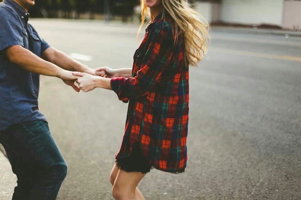 couple dancing in the street in plaid shirt