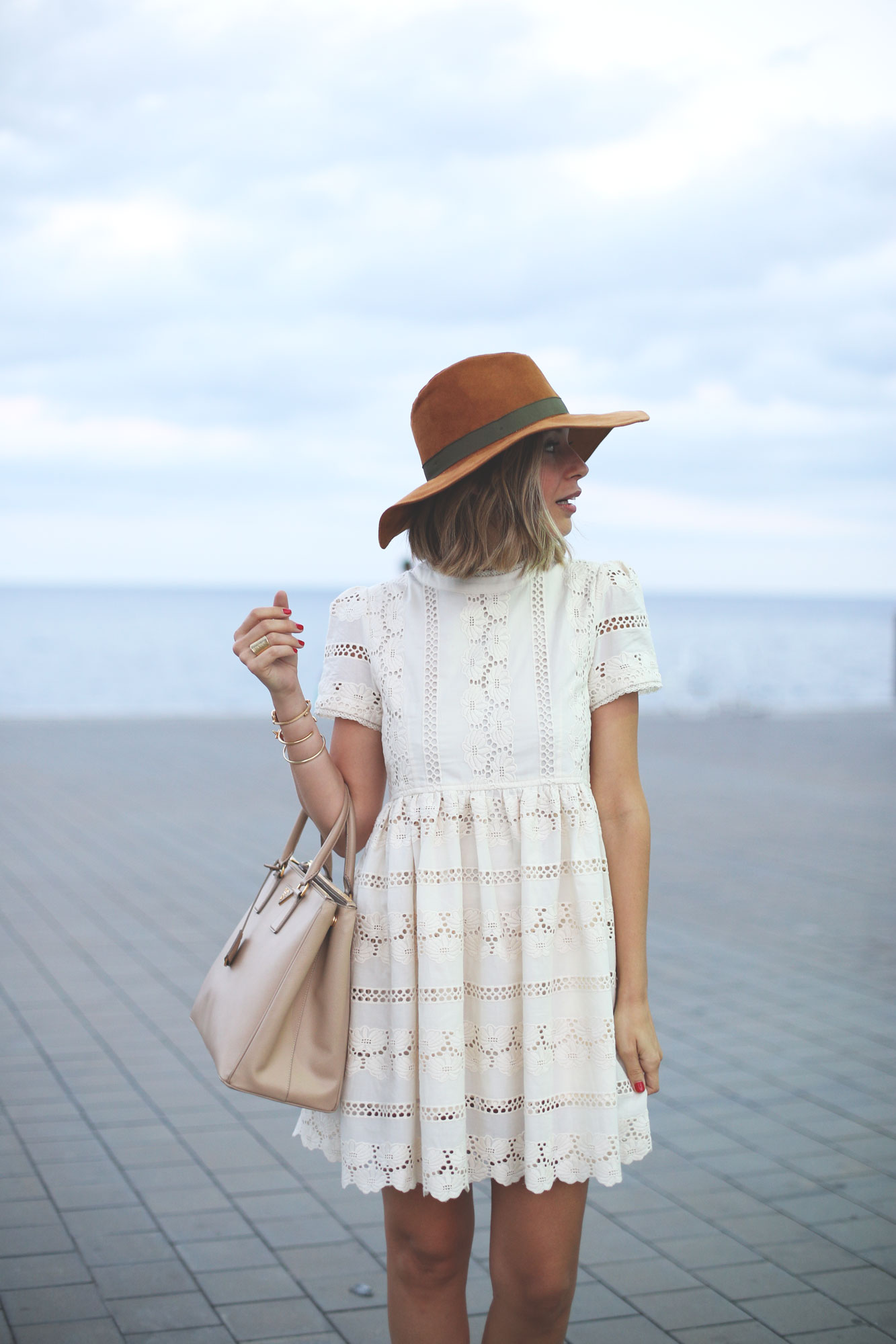 tan hat and white lace dress