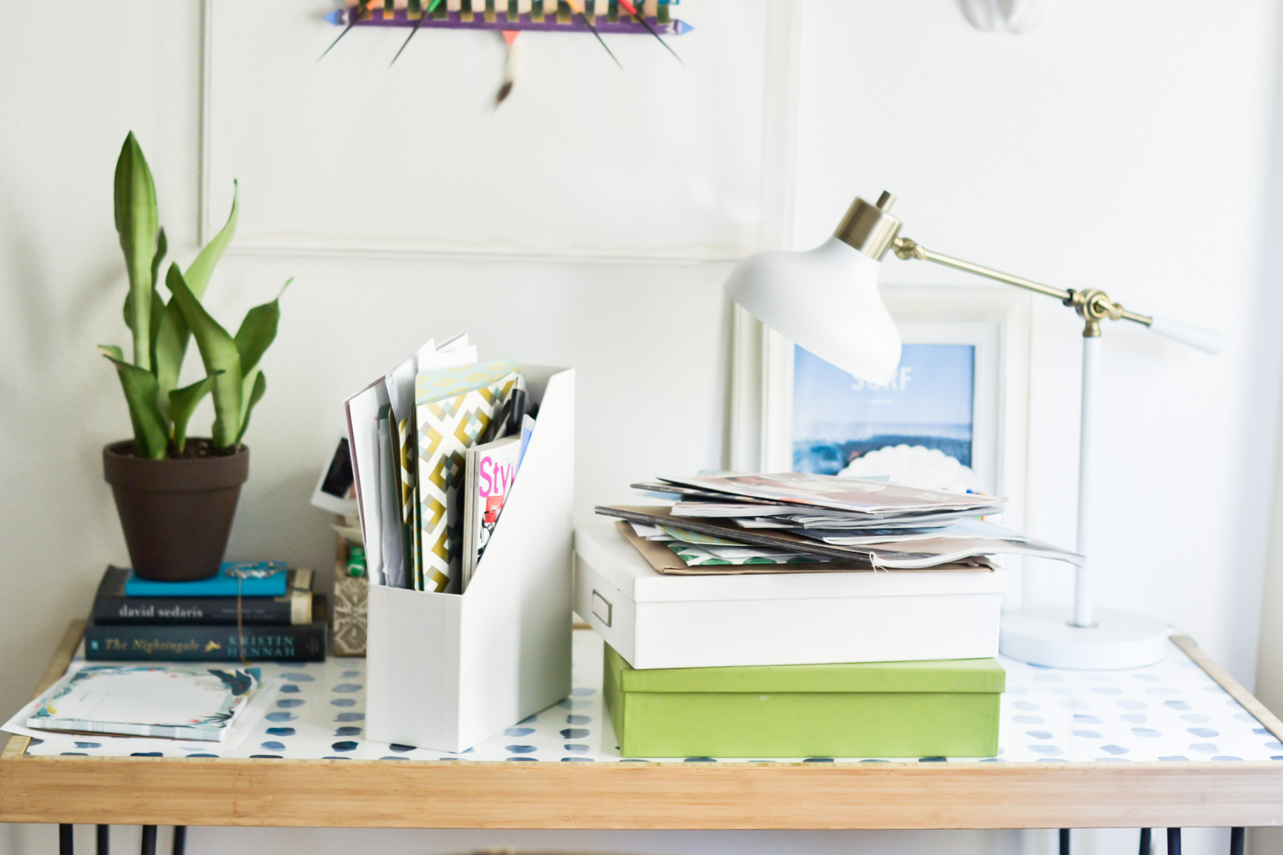 stylish desk with lots of paperwork