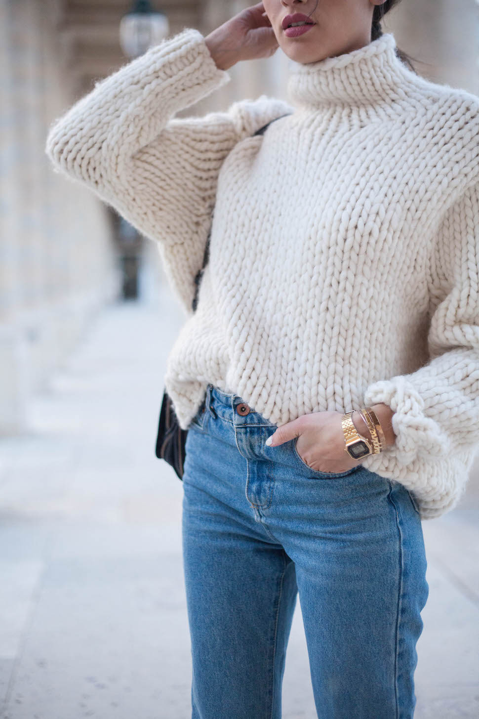 chunky sweater half tuck into jeans