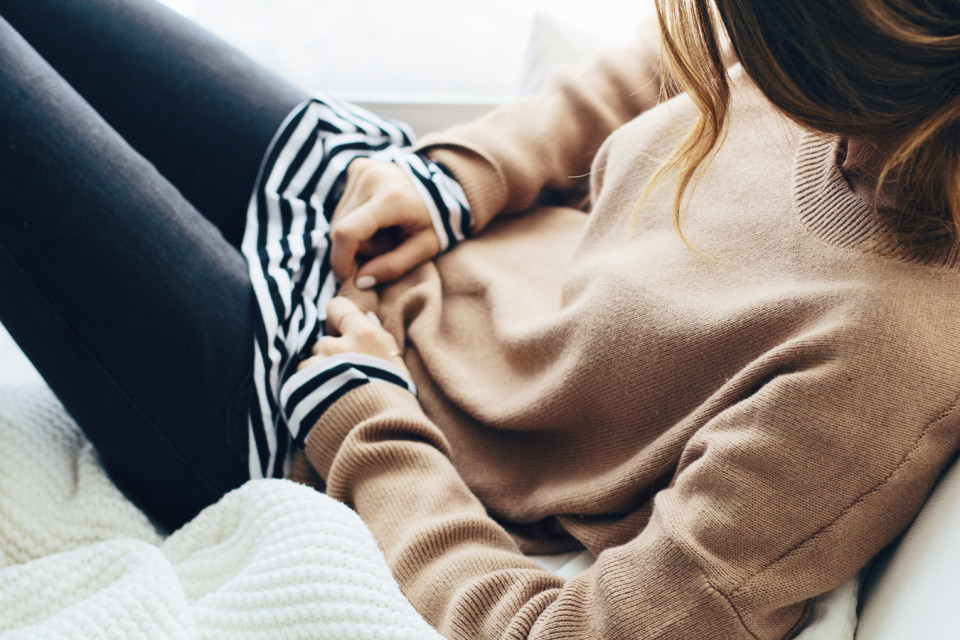 layers with camel sweater and striped tee