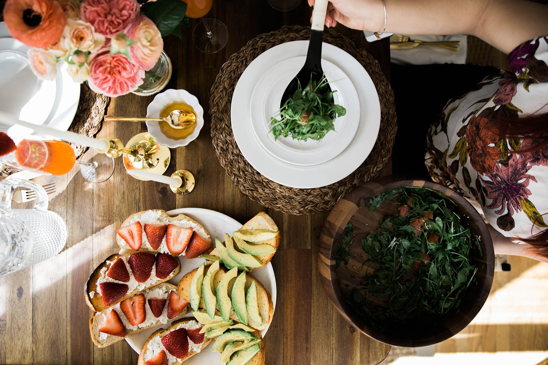 spring brunch setting with avocado toast and arugula salad