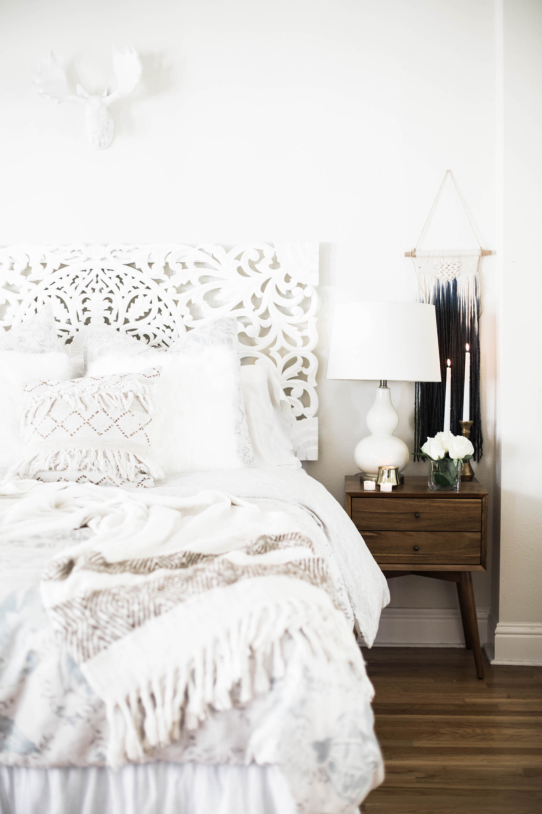 Amanda Holstein's cozy bedroom with white textures from Anthropologie and West Elm side table