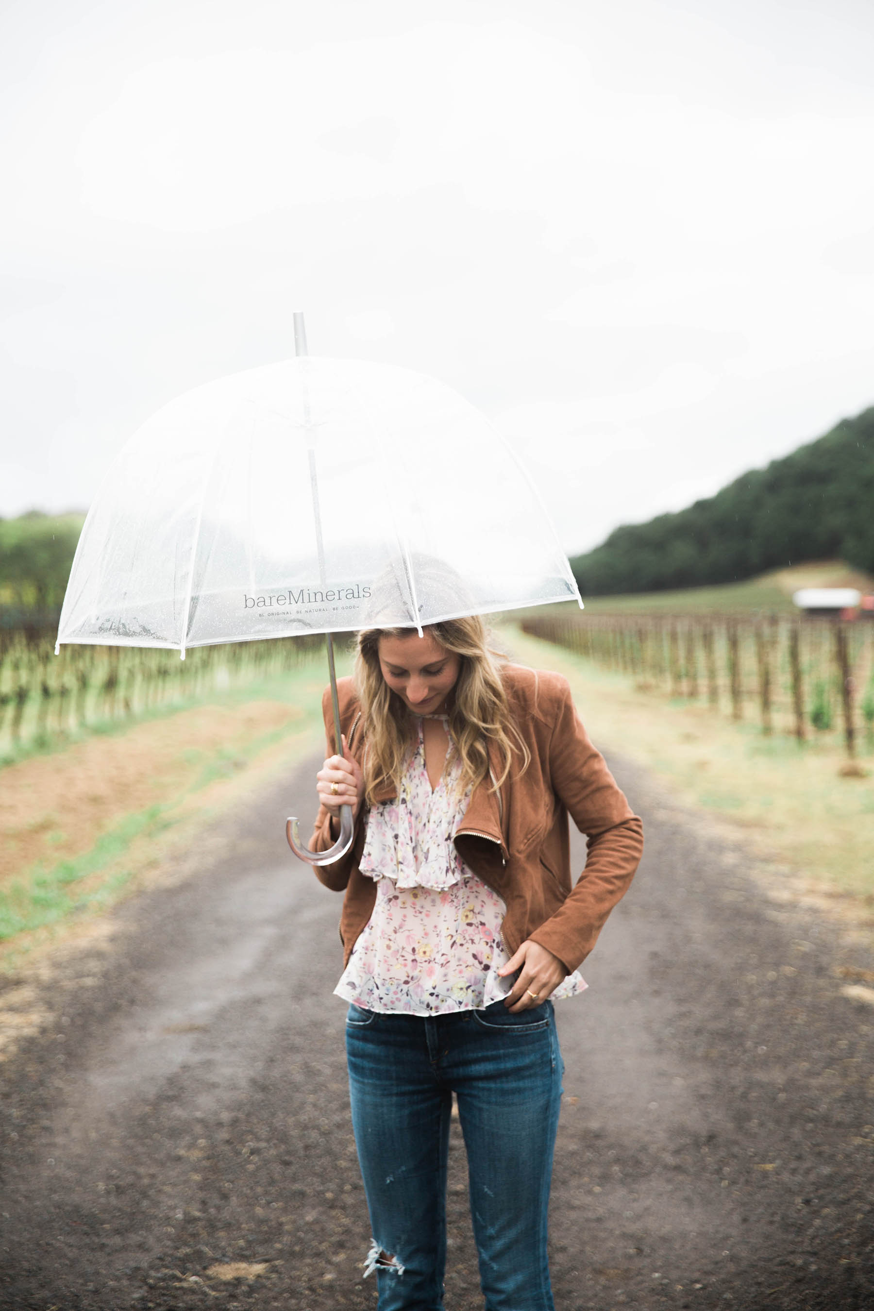 Amanda Holstien in Napa in floral blouse and brown suede jacket