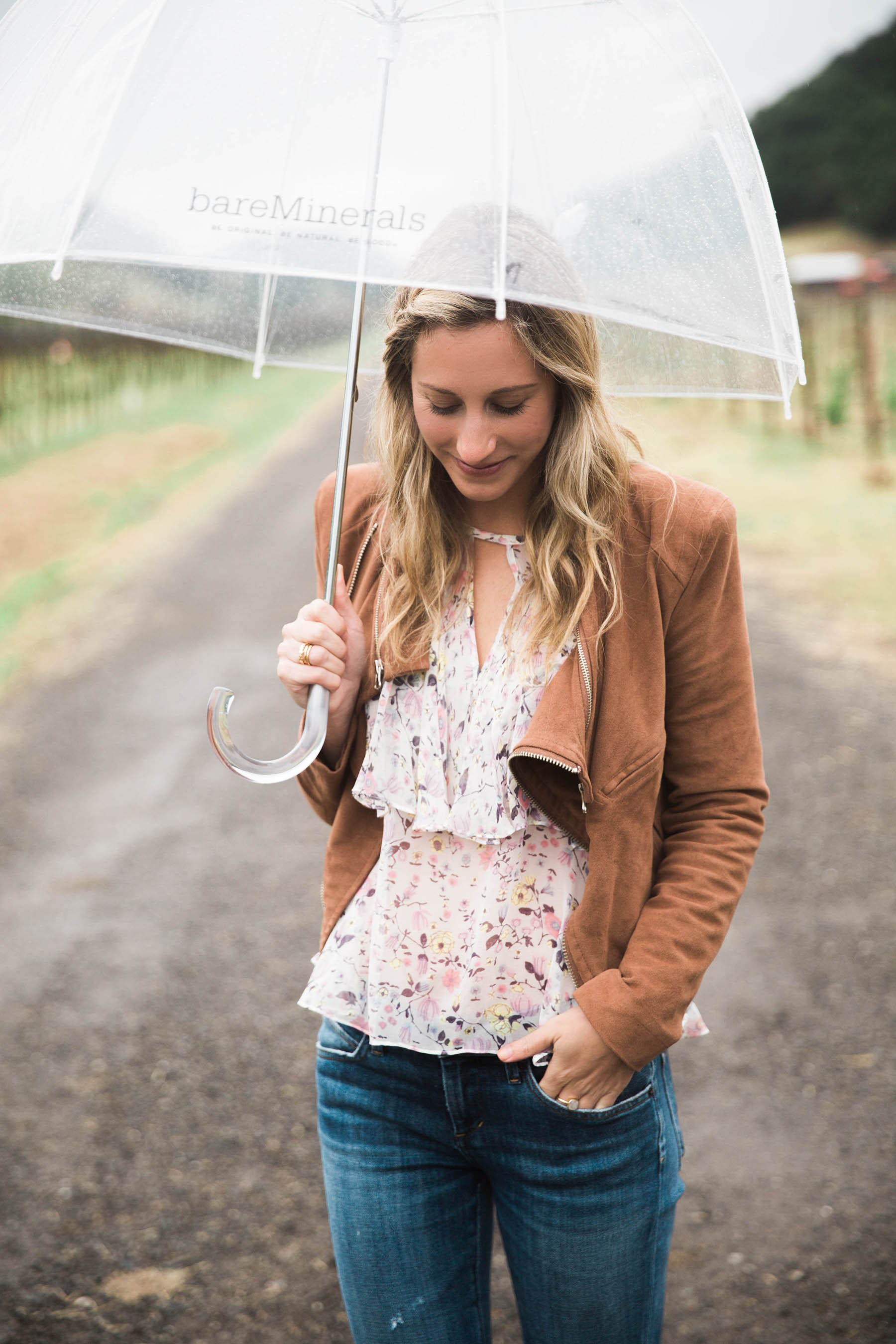 Amanda Holstien in Napa in floral blouse and brown suede jacket