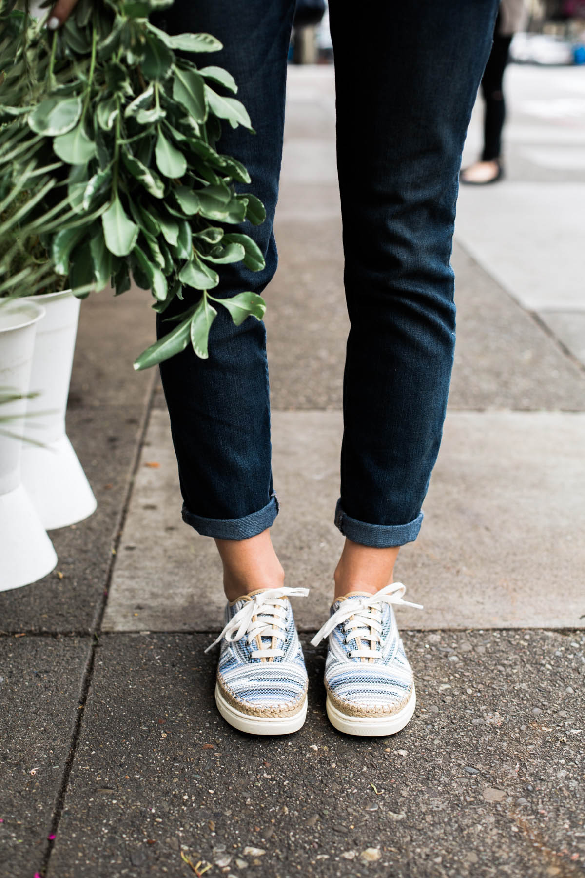 denim overalls and UGG sneakers