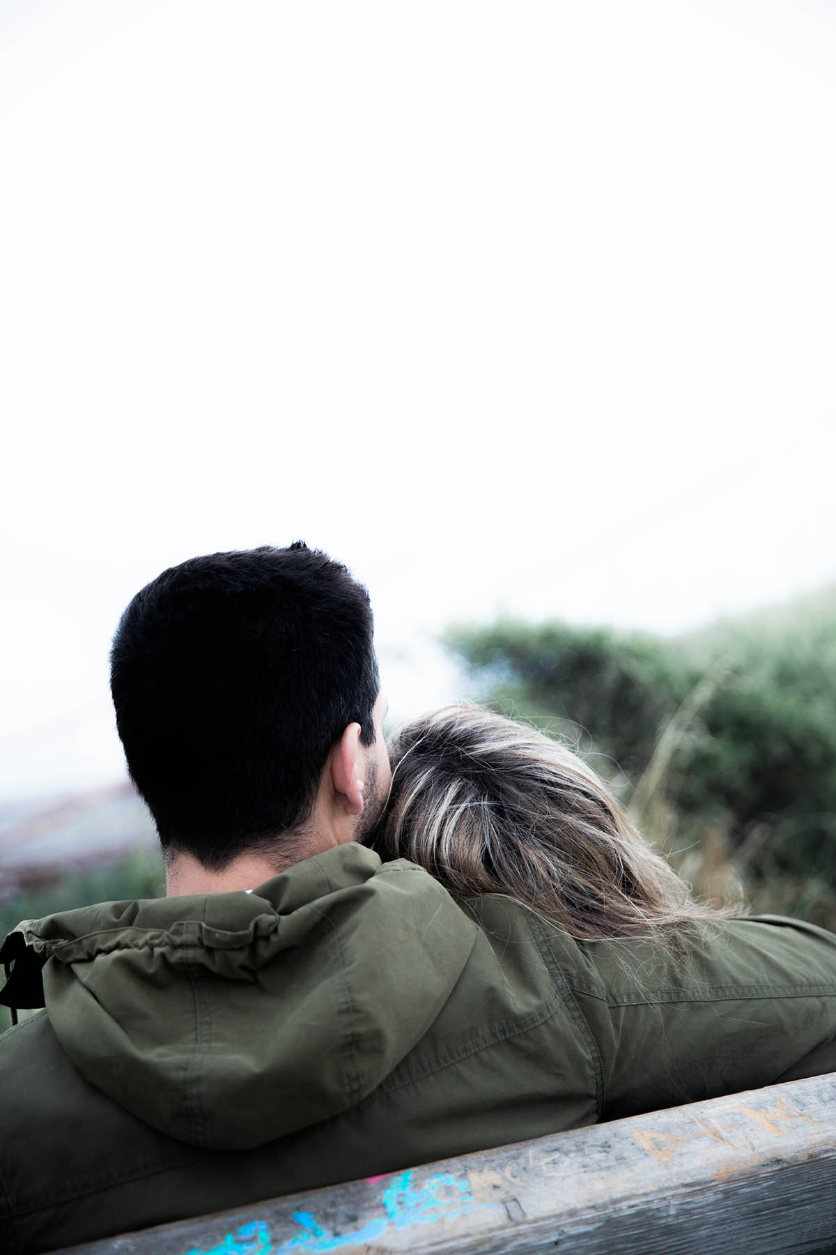 couple on a bench overlooking the view in San francisco