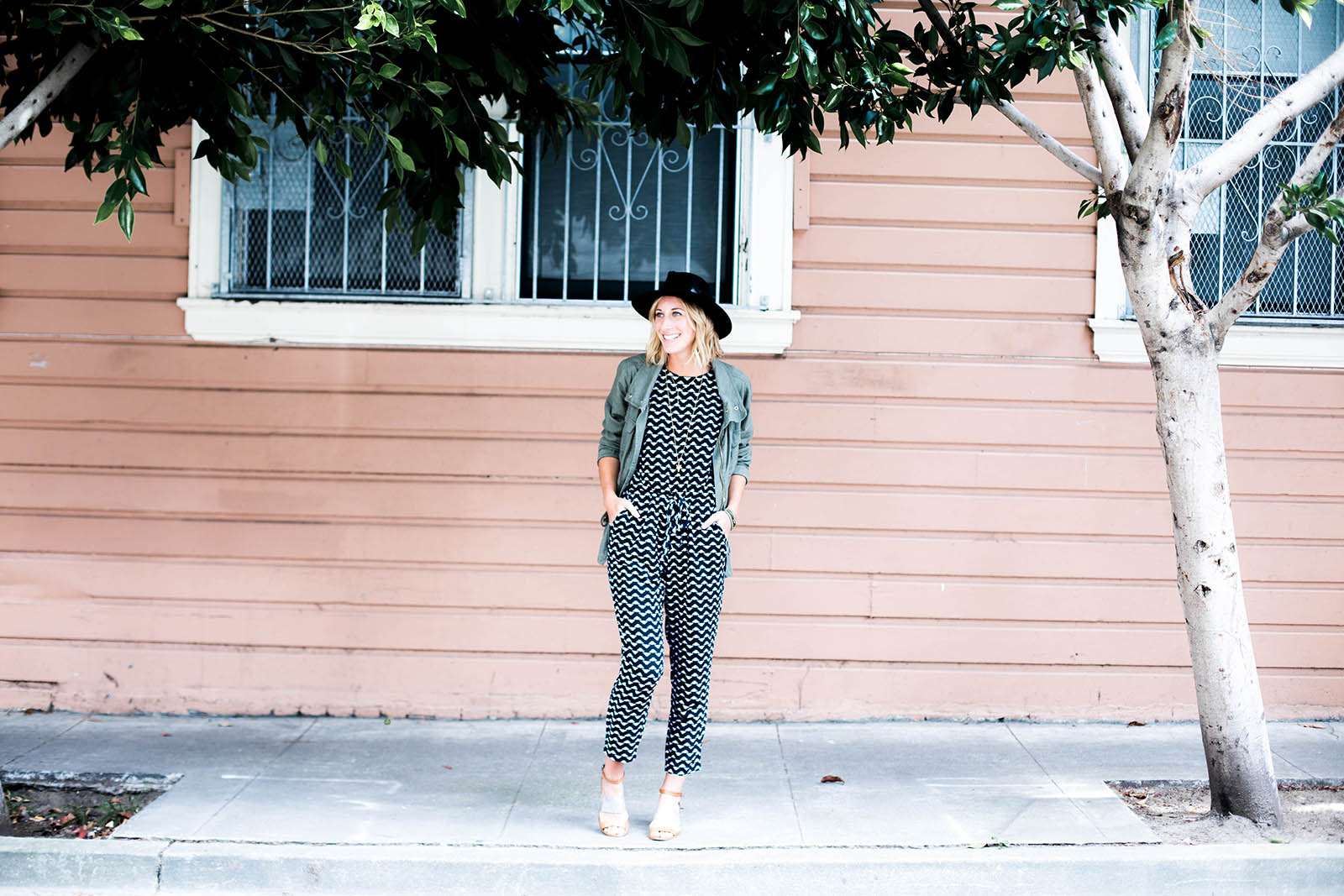 Amanda Holstein in Old Navy printed jumpsuit outfit and utility jacket