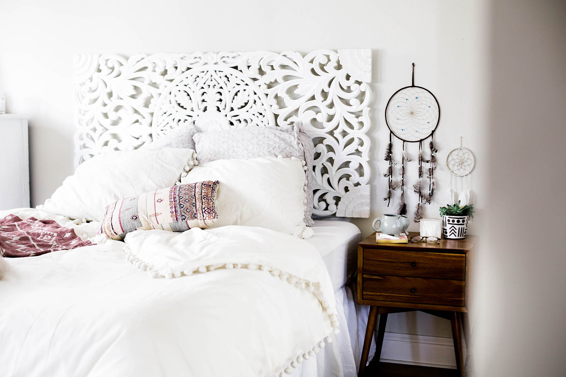 Urban Outfitters bedroom with Magical Thinking Pom-Fringe Duvet Cover and Agda Printed Yarn Pillow and Sienna Headboard