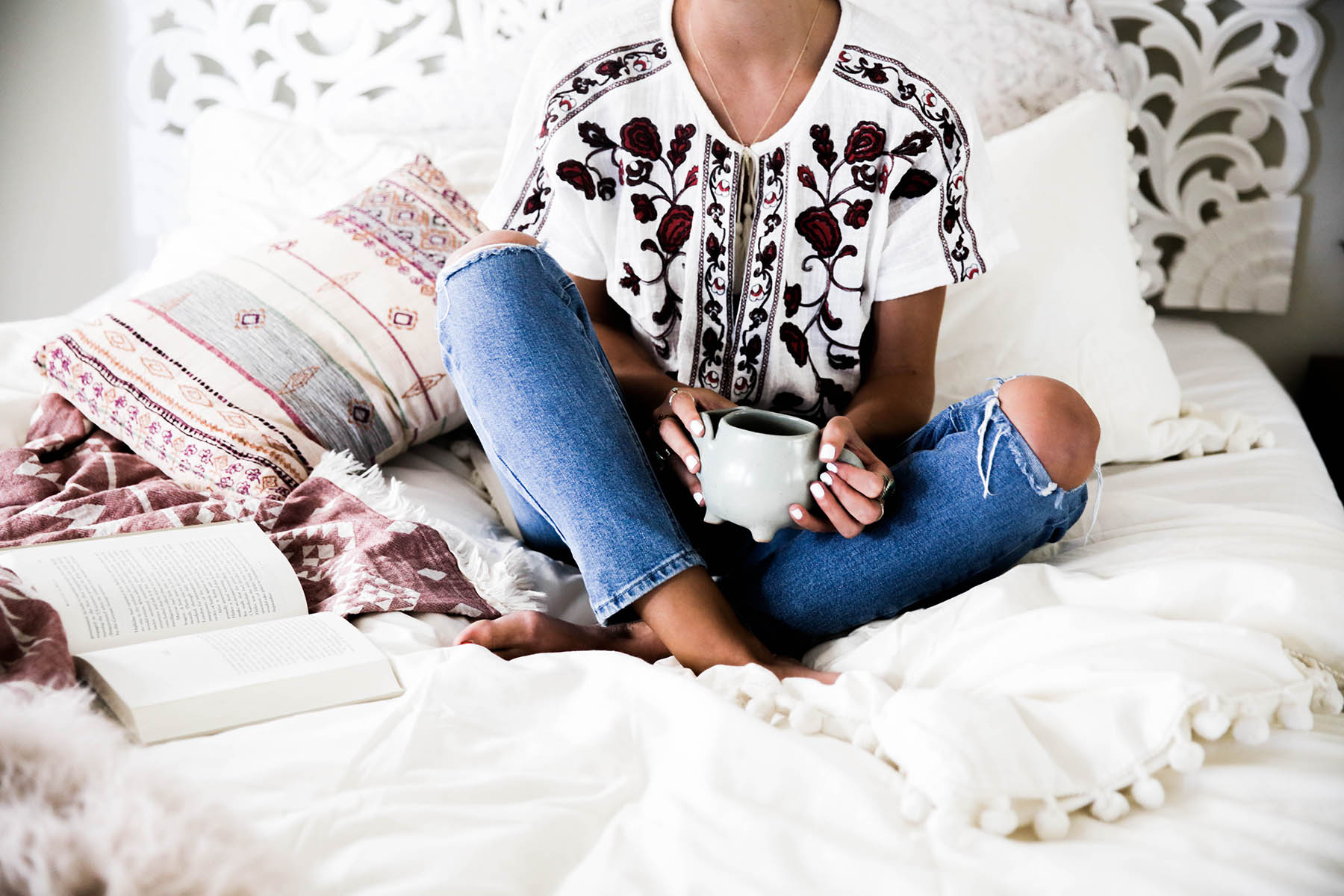 Urban Outfitters bedroom with Magical Thinking Pom-Fringe Duvet Cover and Agda Printed Yarn Pillow and Sienna Headboard