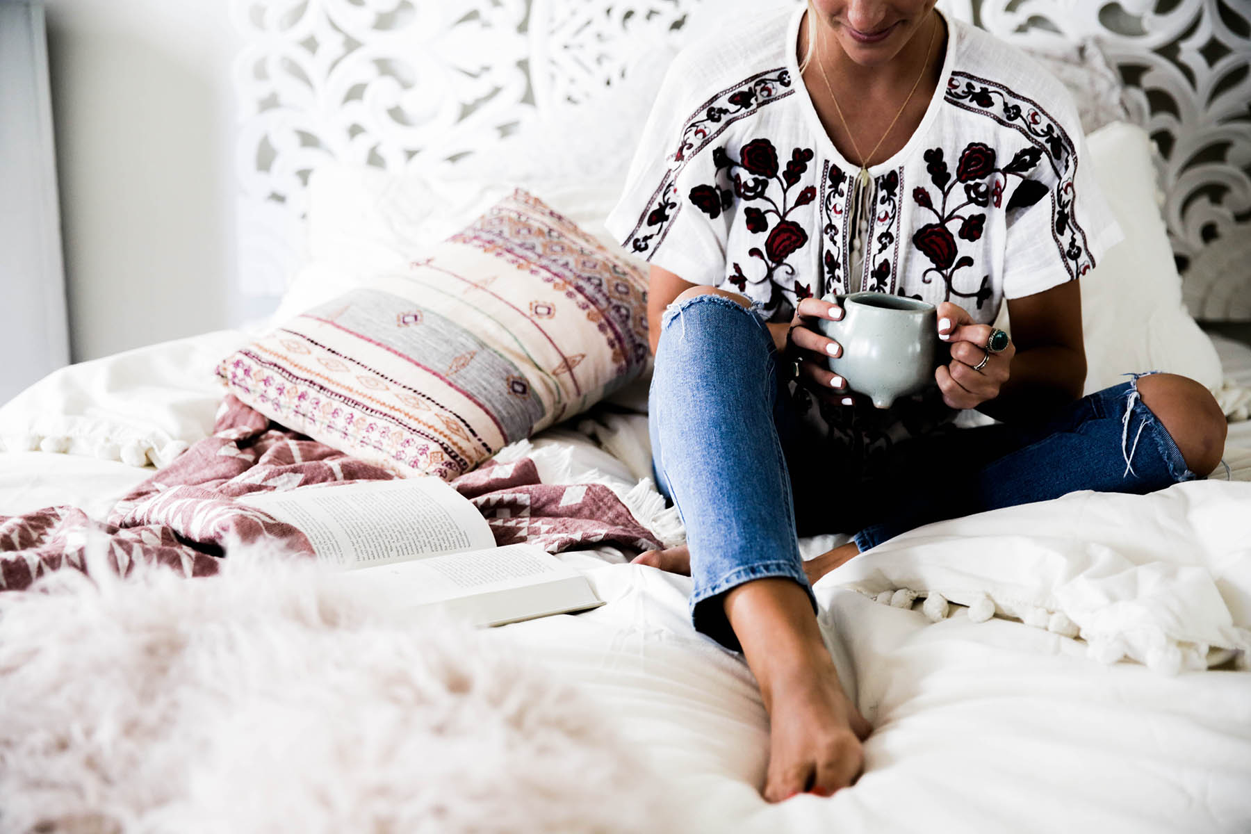 coffee in bed with Urban Outfitters Magical Thinking Pom-Fringe Duvet Cover and Agda Printed Yarn Pillow