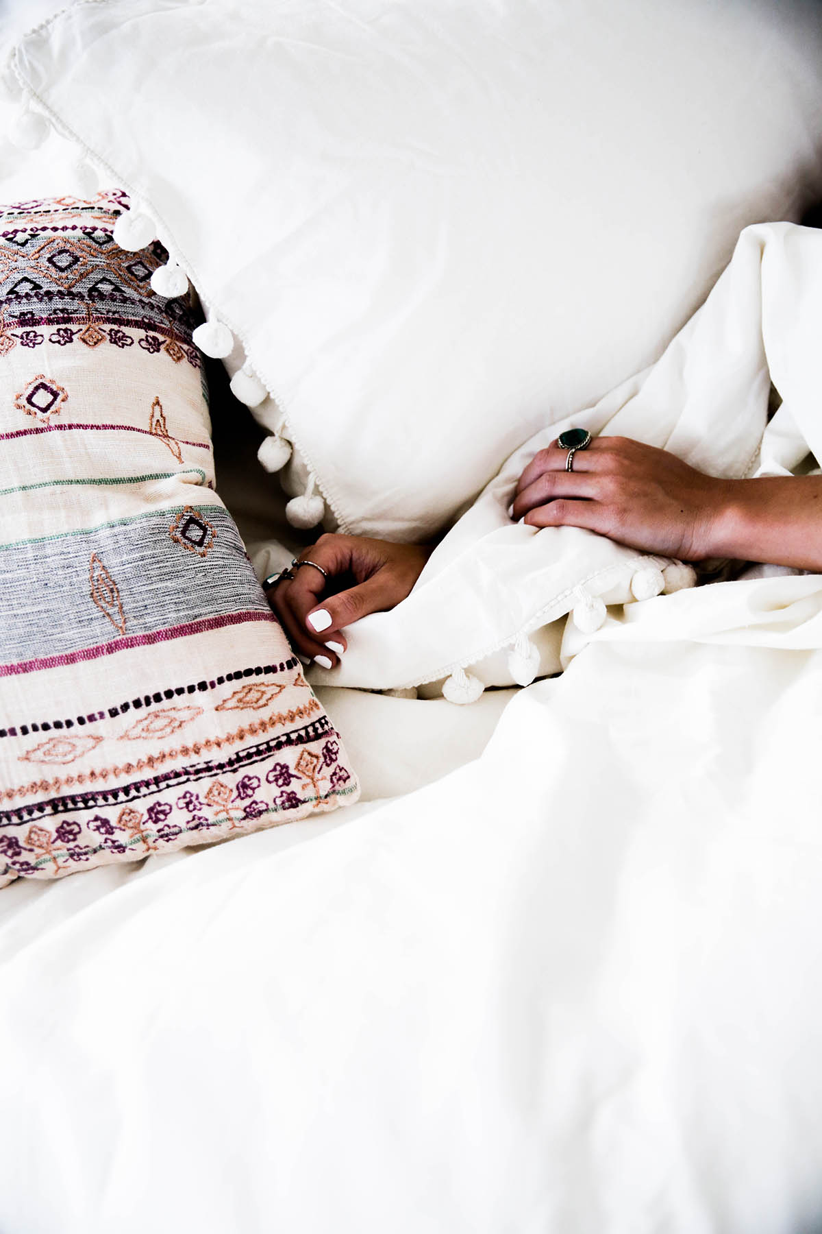 Urban Outfitters bedroom with Magical Thinking Pom-Fringe Duvet Cover and Agda Printed Yarn Pillow