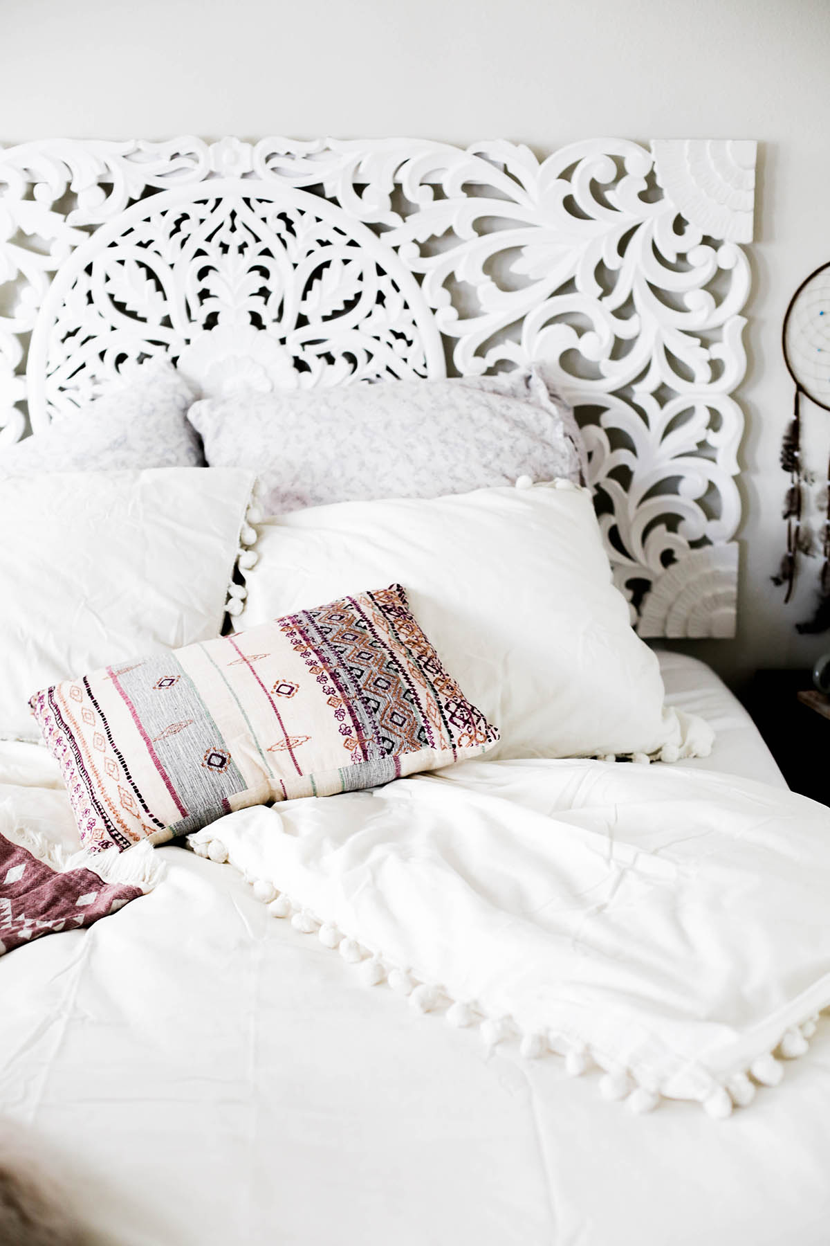 Urban Outfitters bedroom with Magical Thinking Pom-Fringe Duvet Cover and Agda Printed Yarn Pillow