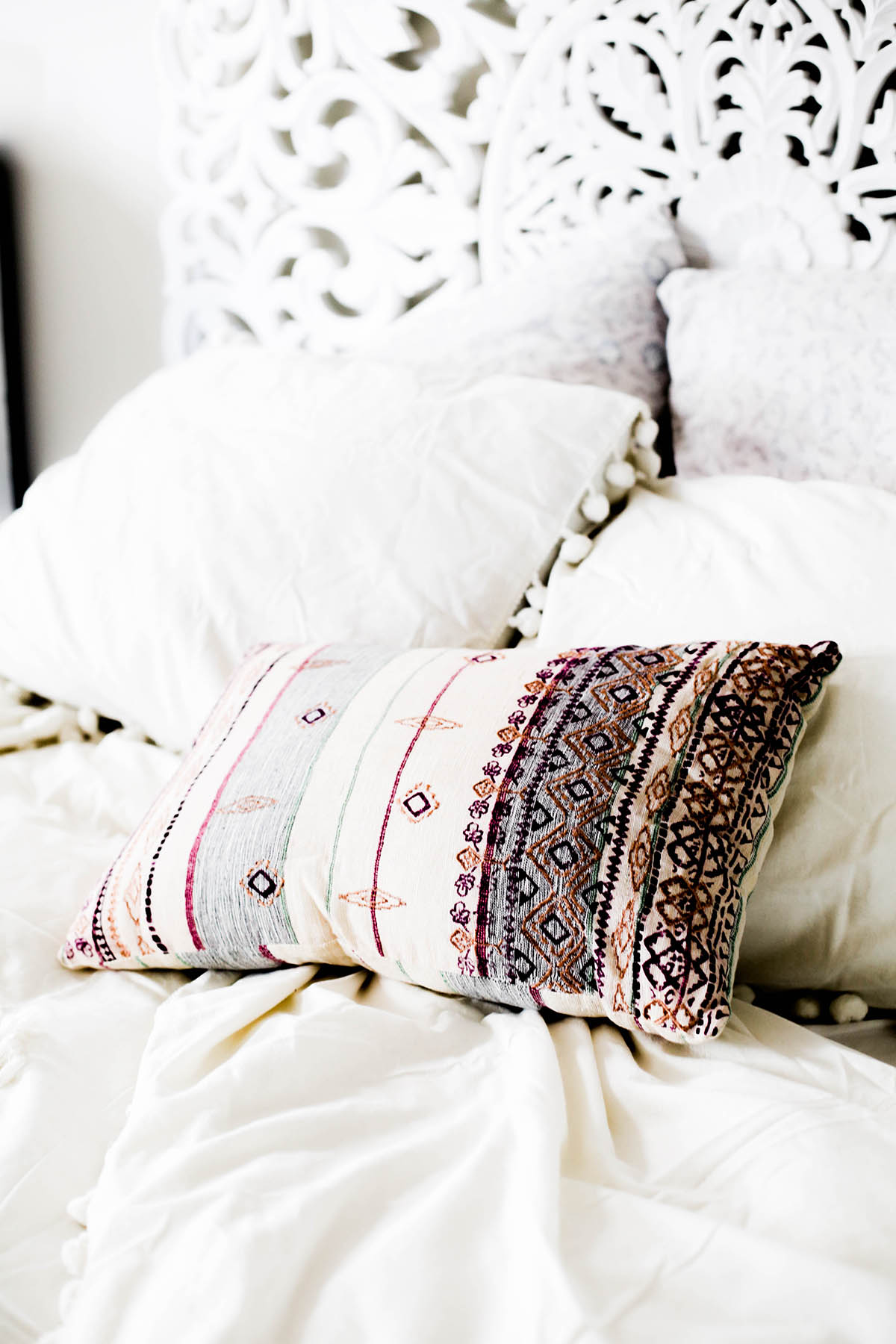 Urban Outfitters bedroom with Magical Thinking Pom-Fringe Duvet Cover and Agda Printed Yarn Pillow