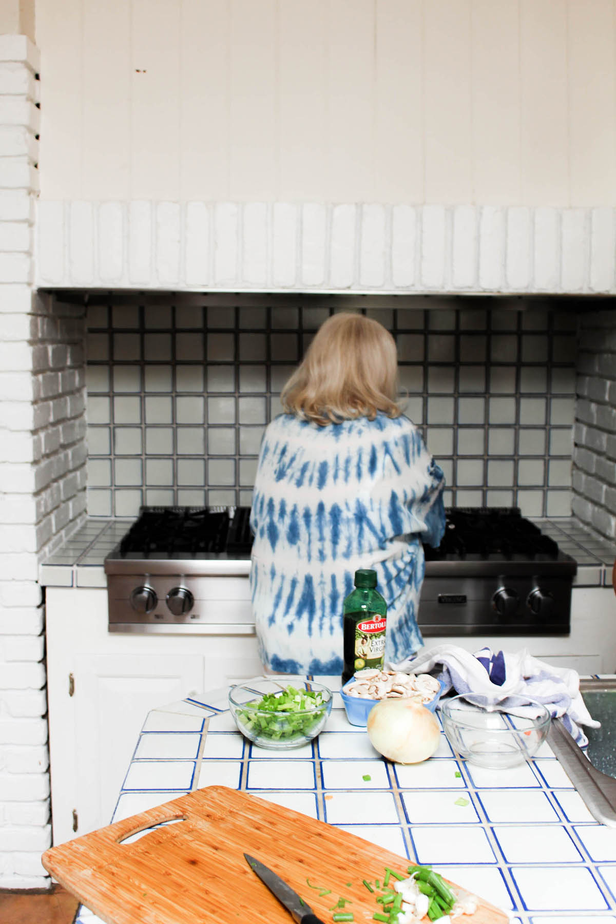 cooking with grandma in all white rustic kitchen