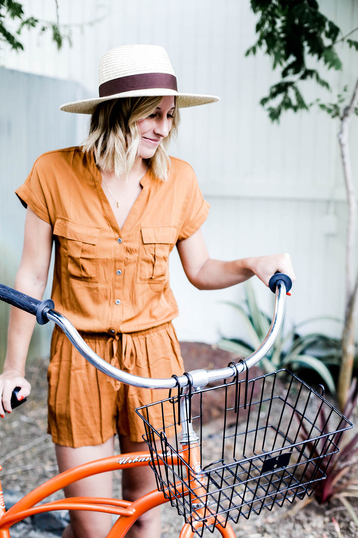 Amanda Holstein in Old Navy romper and woven fedora hat