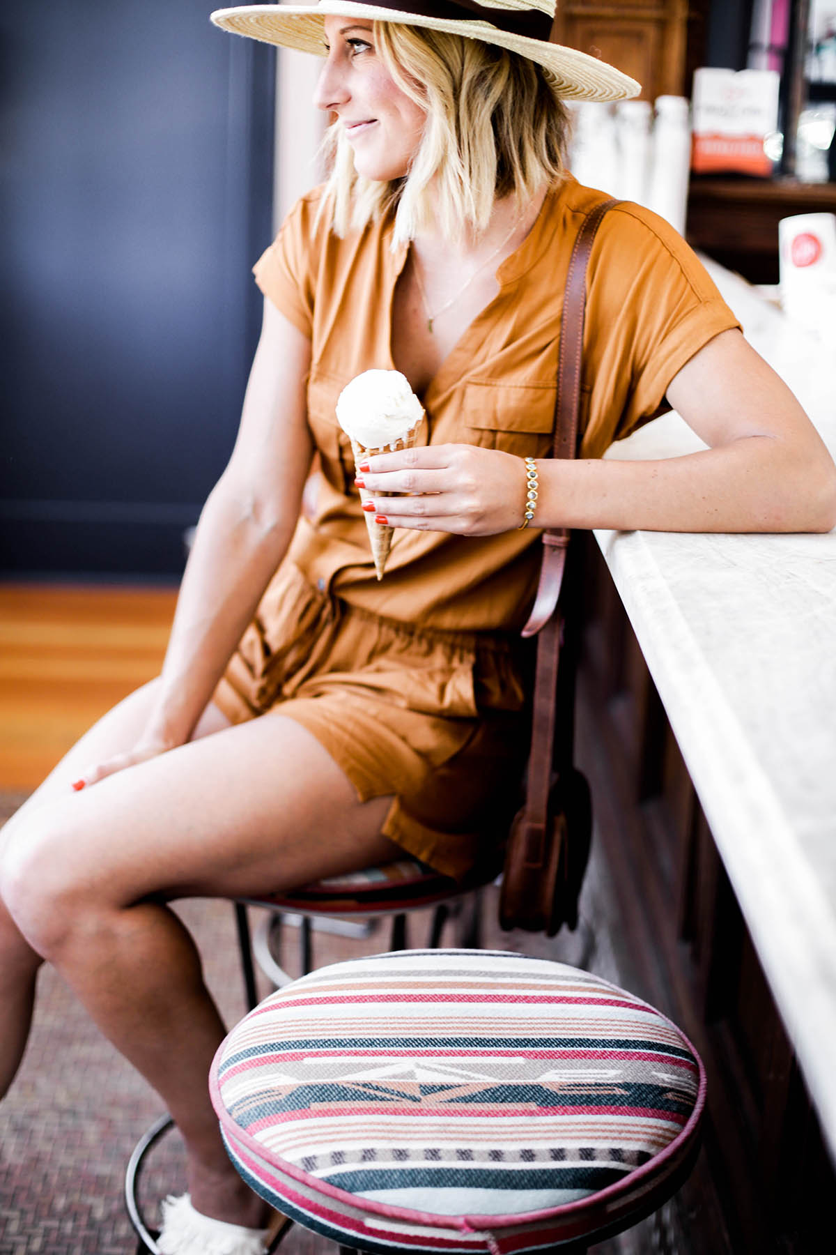 Amanda Holstein in Old Navy romper and woven fedora hat at Nimble & Finn's ice cream