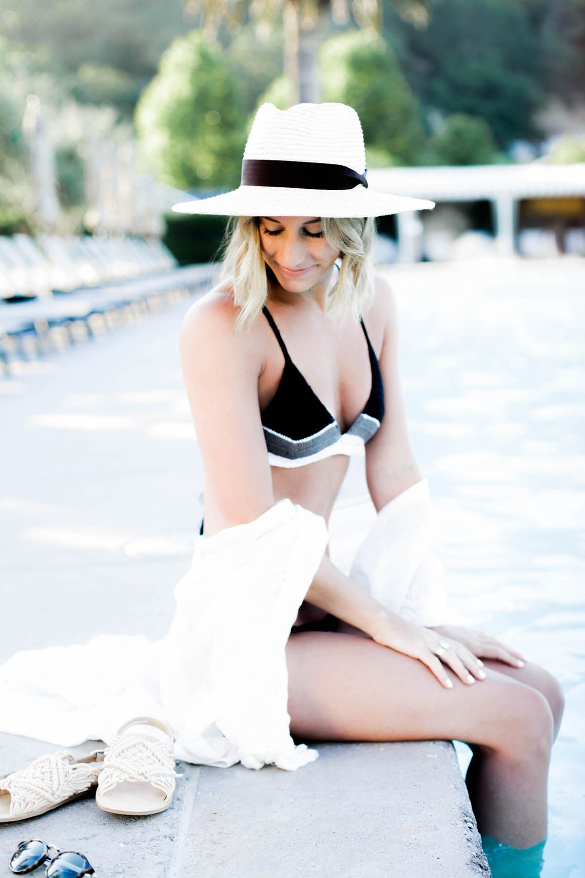 Amanda Holstein's poolside style in Revolve crochet bikini and Urban Outfitters kimono