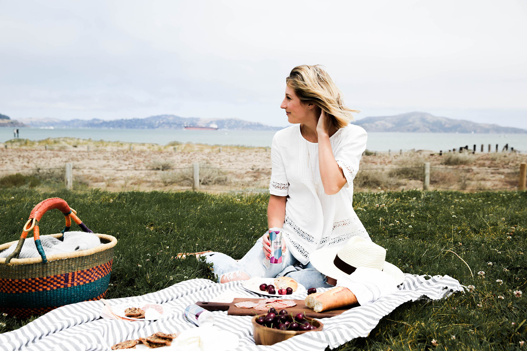 summer picnic with striped blanket, Seven Daughters wine, cheese, and bread