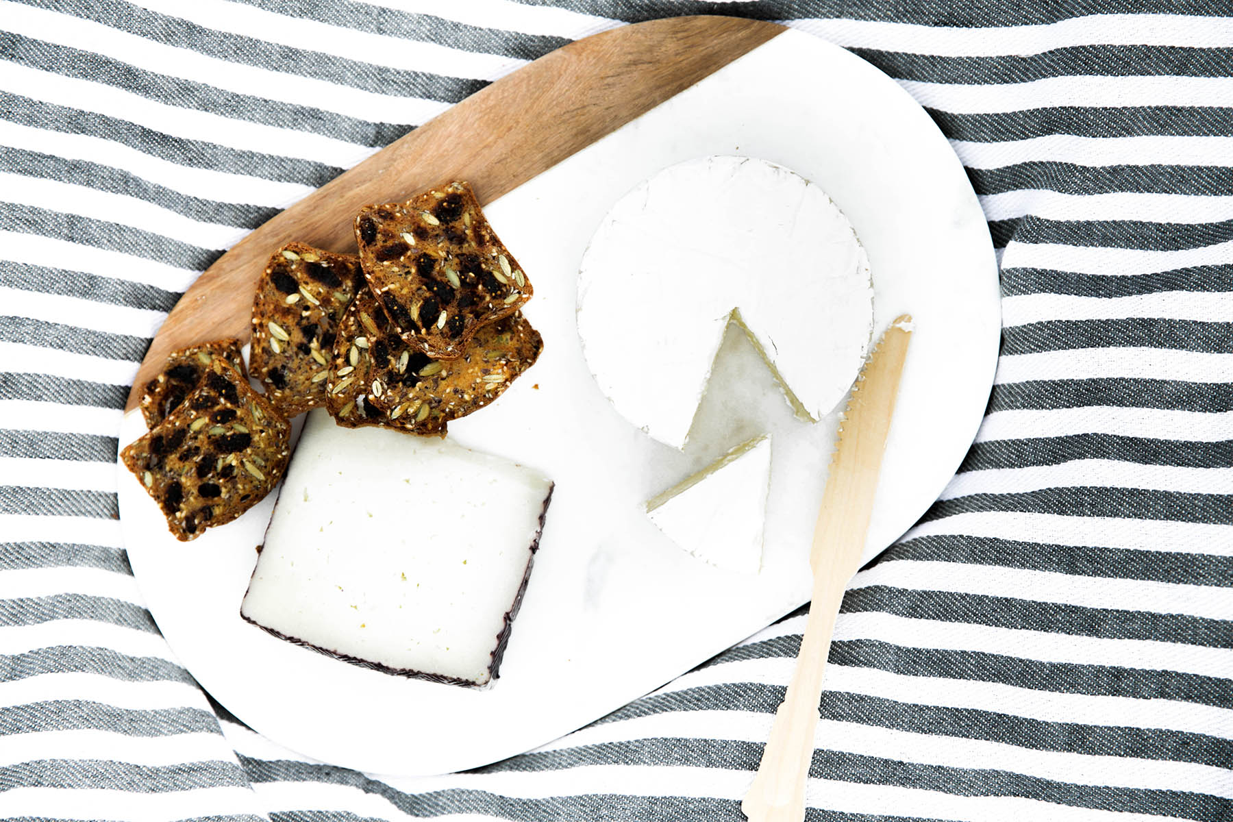 cheese platter on striped blanket for summer picnic