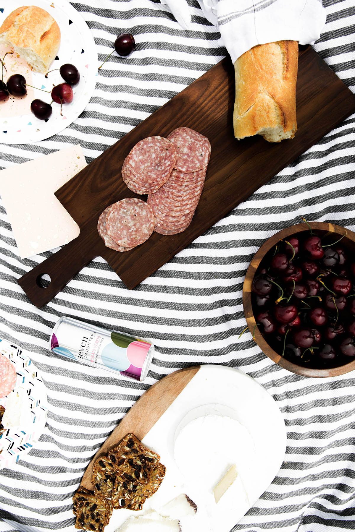 summer picnic with striped blanket, Seven Daughters wine, cheese, and bread