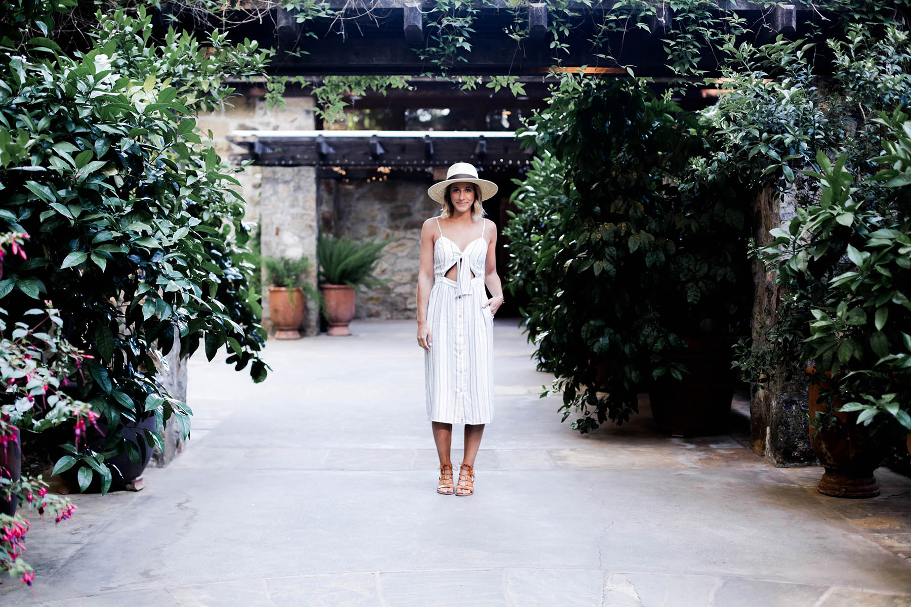 wine tasting outfit wayf tie front dress and revolve hat