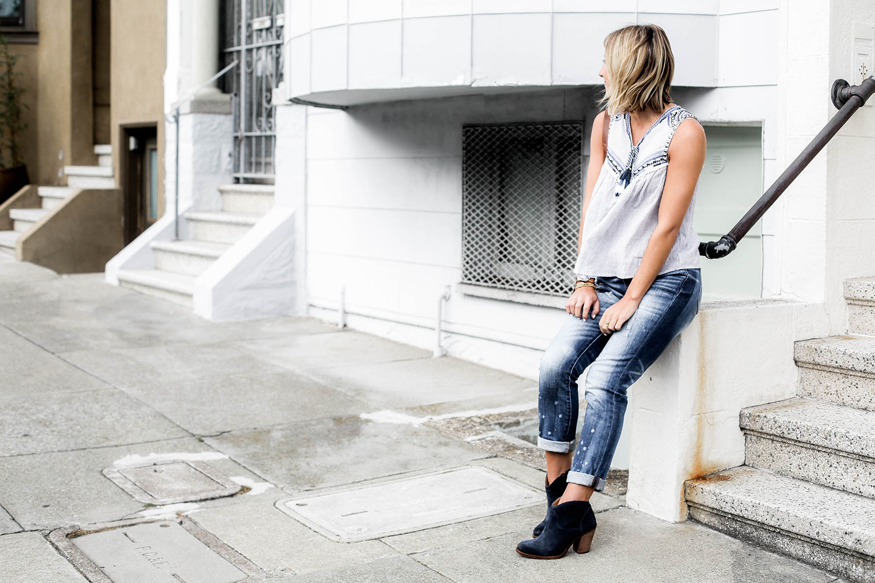 fall fashion trends patchwork denim boyfriend jeans and blue suede ankle boots
