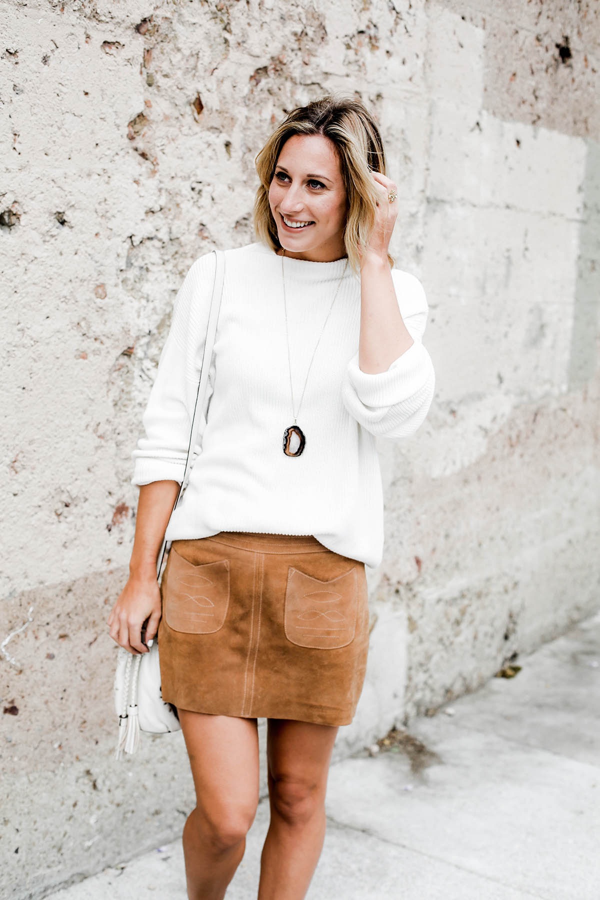 fall fashion trends free people suede miniskirt and oversized sweater and lucky brand cutout booties