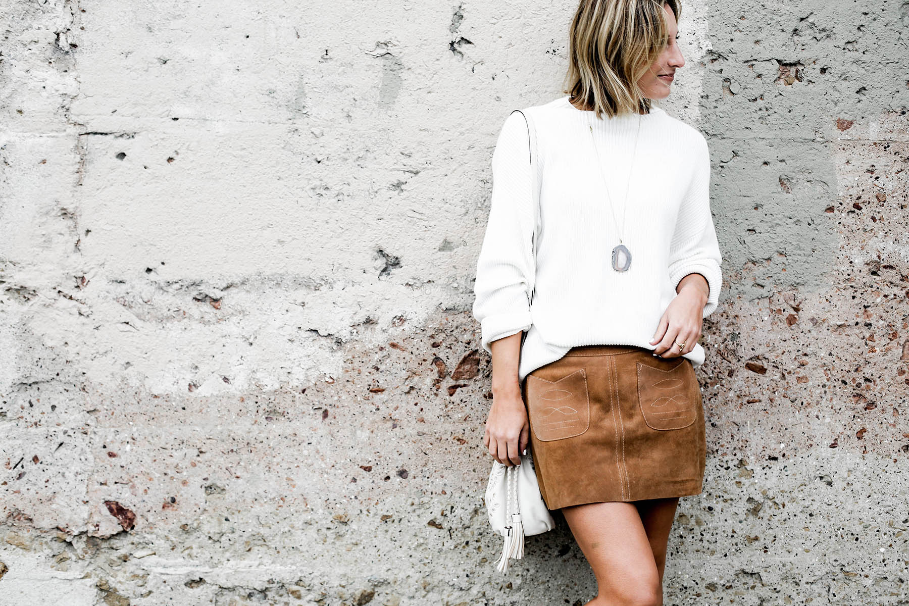 fall fashion trends free people suede miniskirt and oversized sweater and lucky brand cutout booties