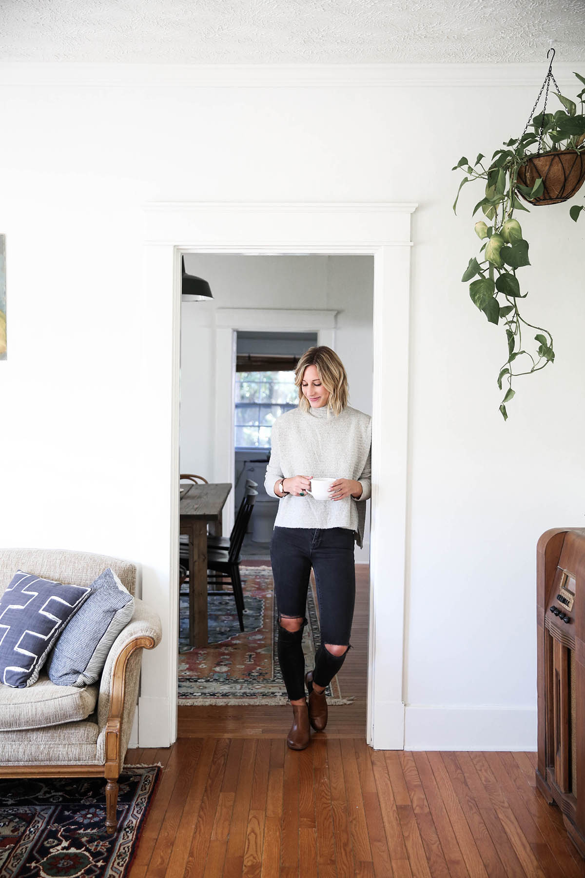 free people arctic fox sweater with chelsea boots and black distressed skinny jeans