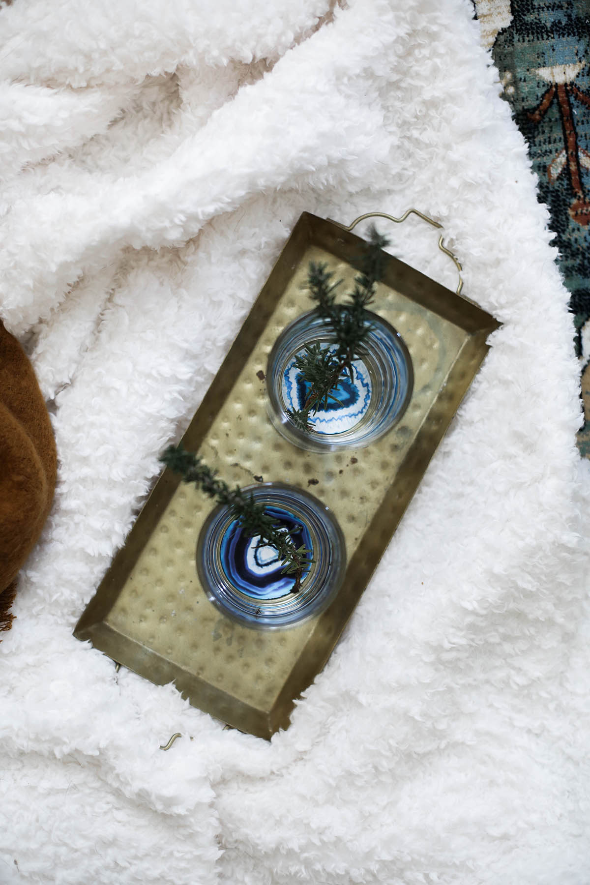 urban outfitters geode bottom glasses with gold tray and fleece throw blanket