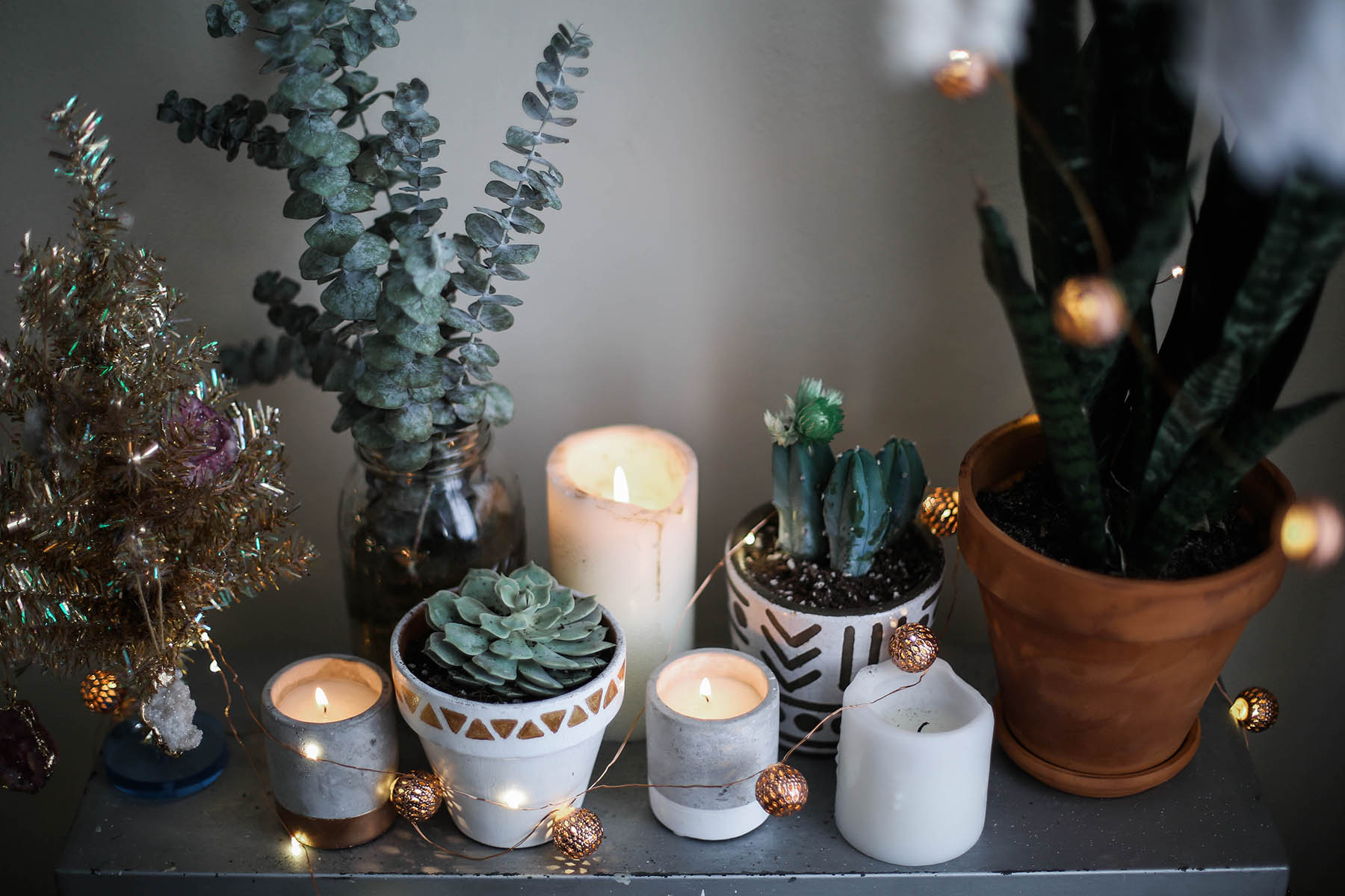 candles, succulents, and planters for cozy bohemian holiday decorations with Urban Outfitters home