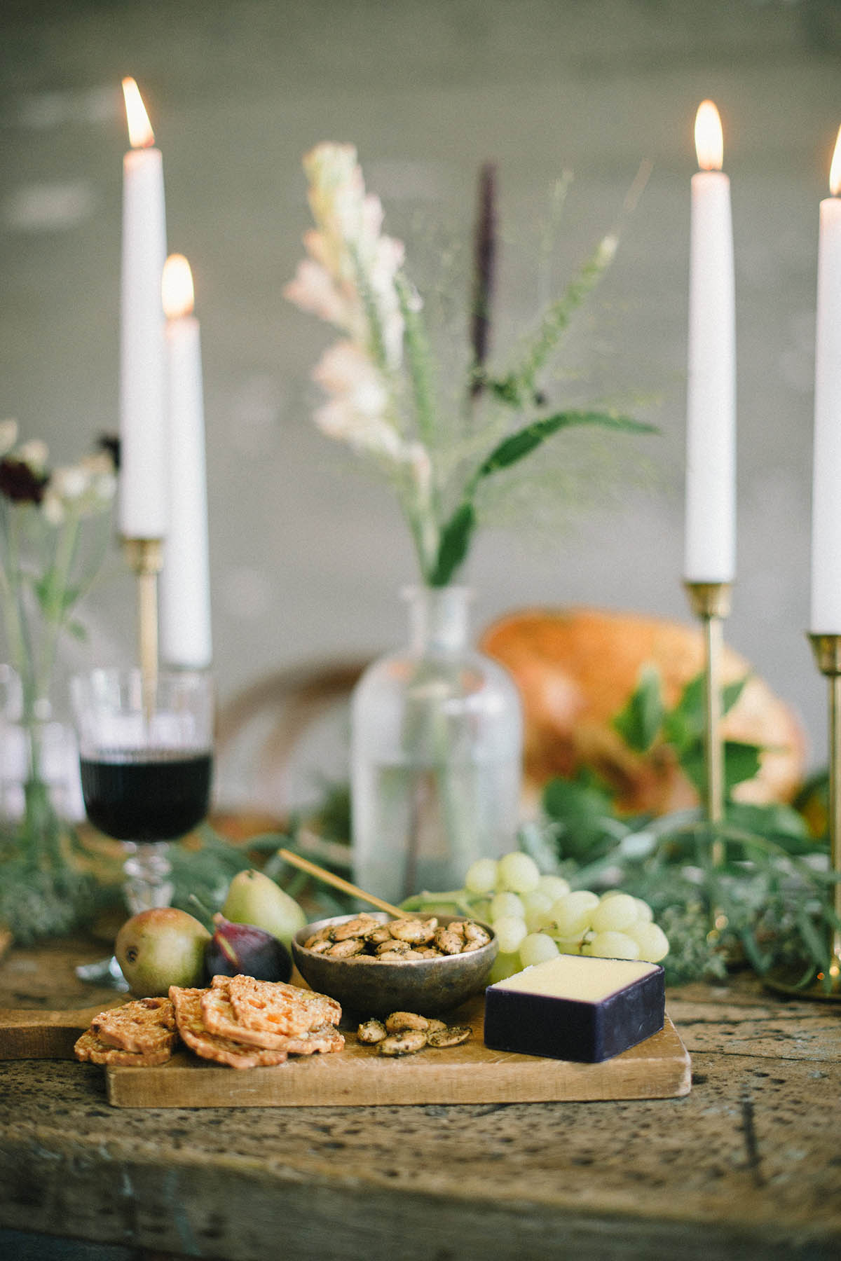 cheese plate at rustic friendsgiving tablescape decor