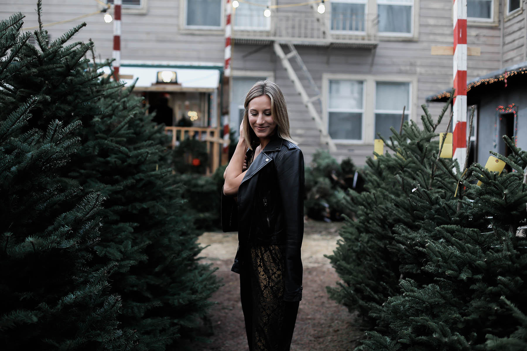 holiday jumpsuit and leather moto jacket