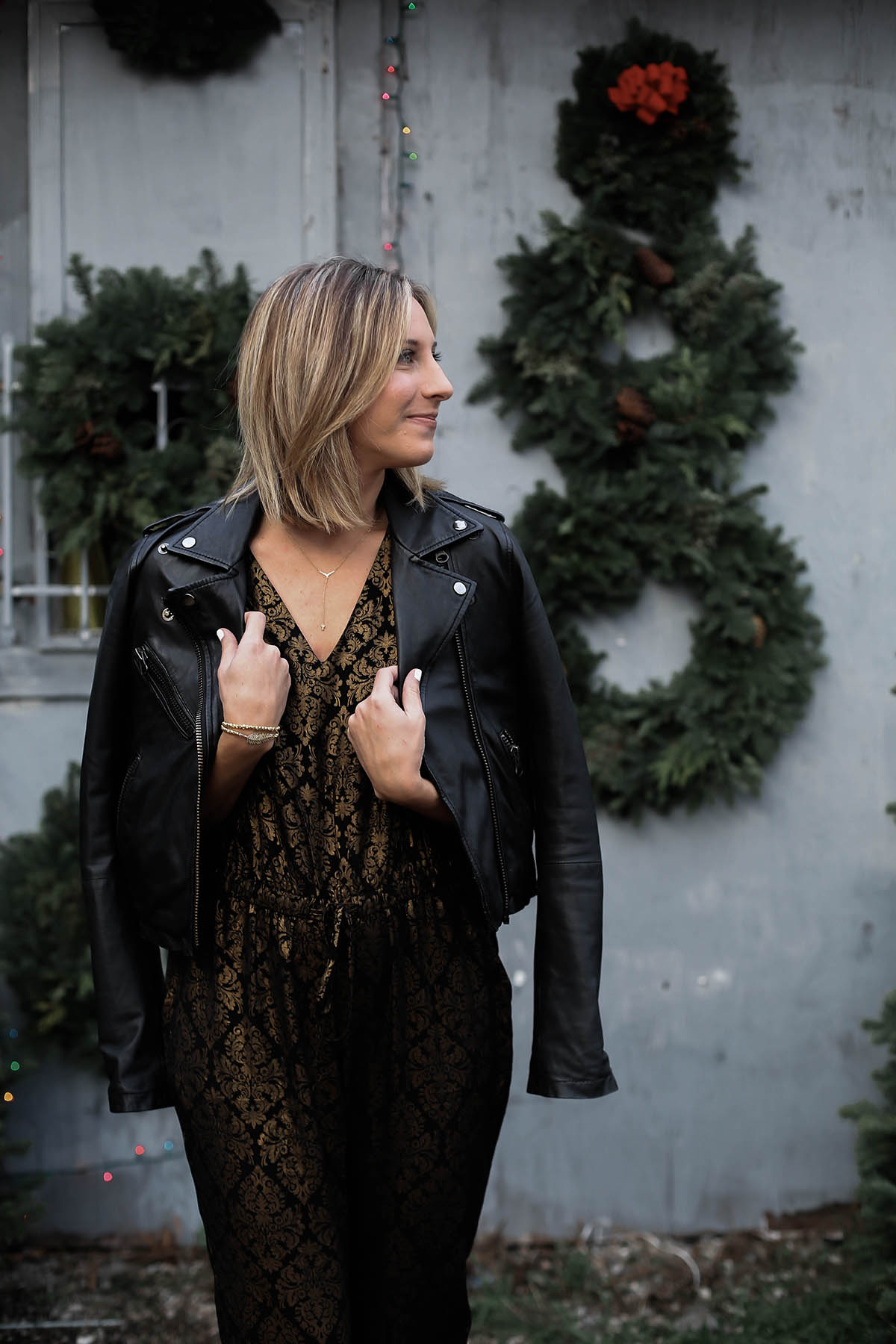 holiday jumpsuit and leather moto jacket