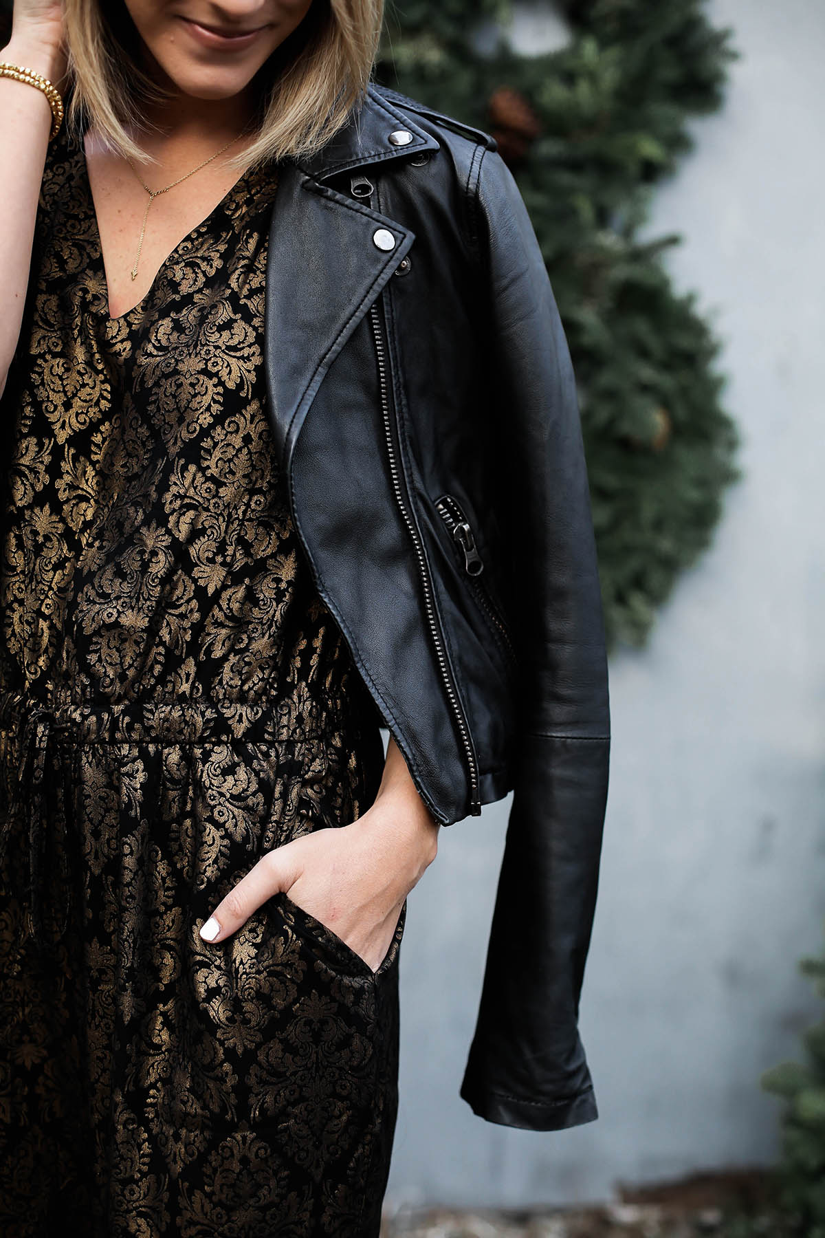 holiday jumpsuit and leather moto jacket