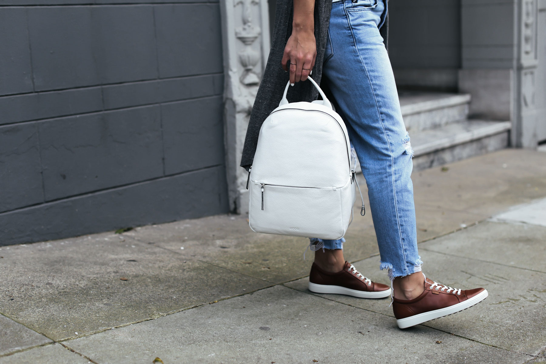 white leather backpack and brown leather sneakers from ECCO