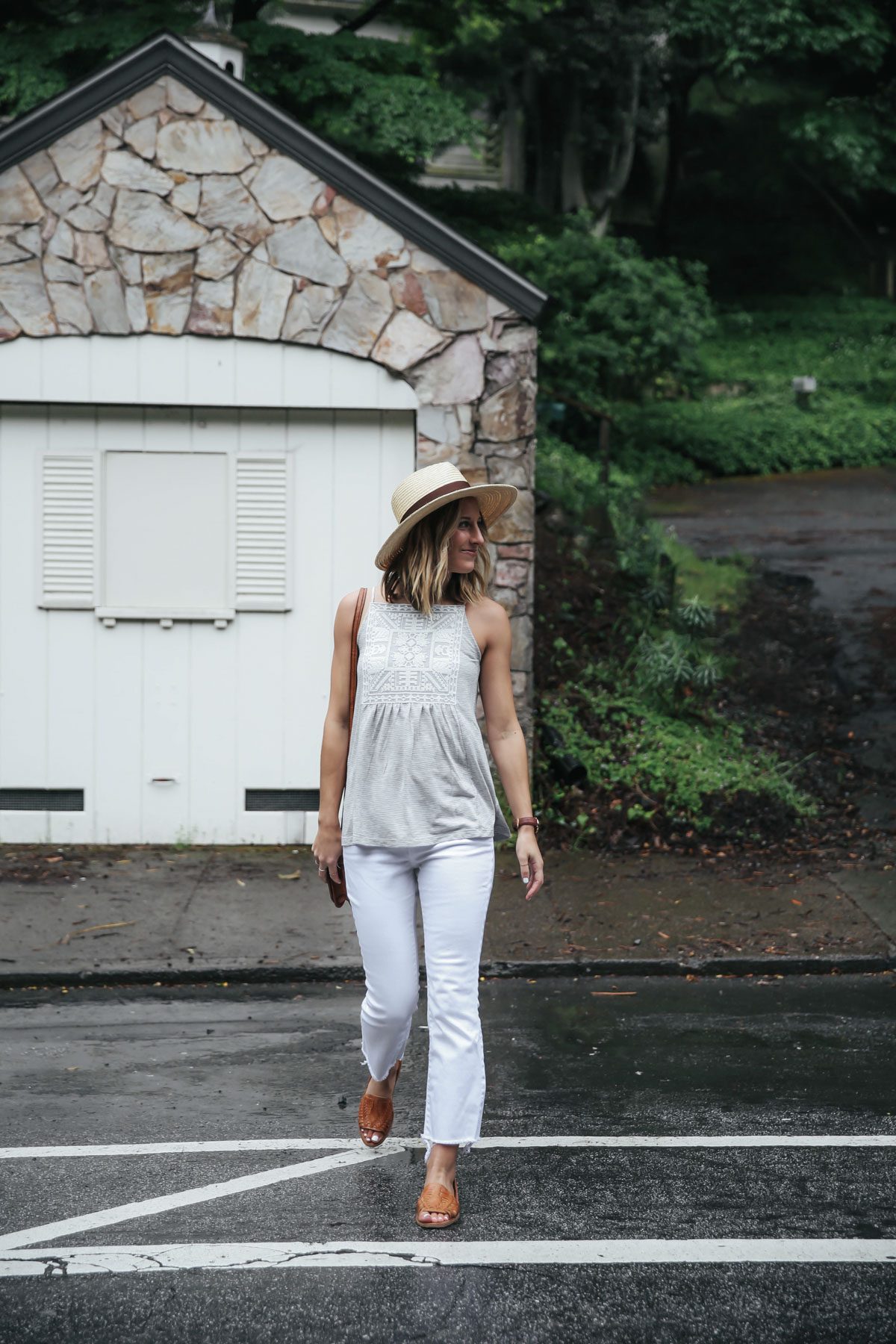 Amanda Holstein in white cropped flare jeans and summer top