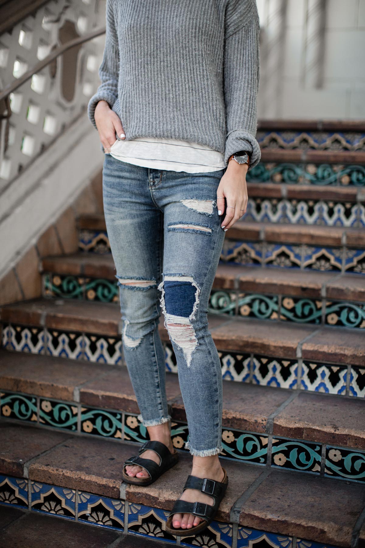 basic outfits with distressed denim, sweater, and birkenstock sandals