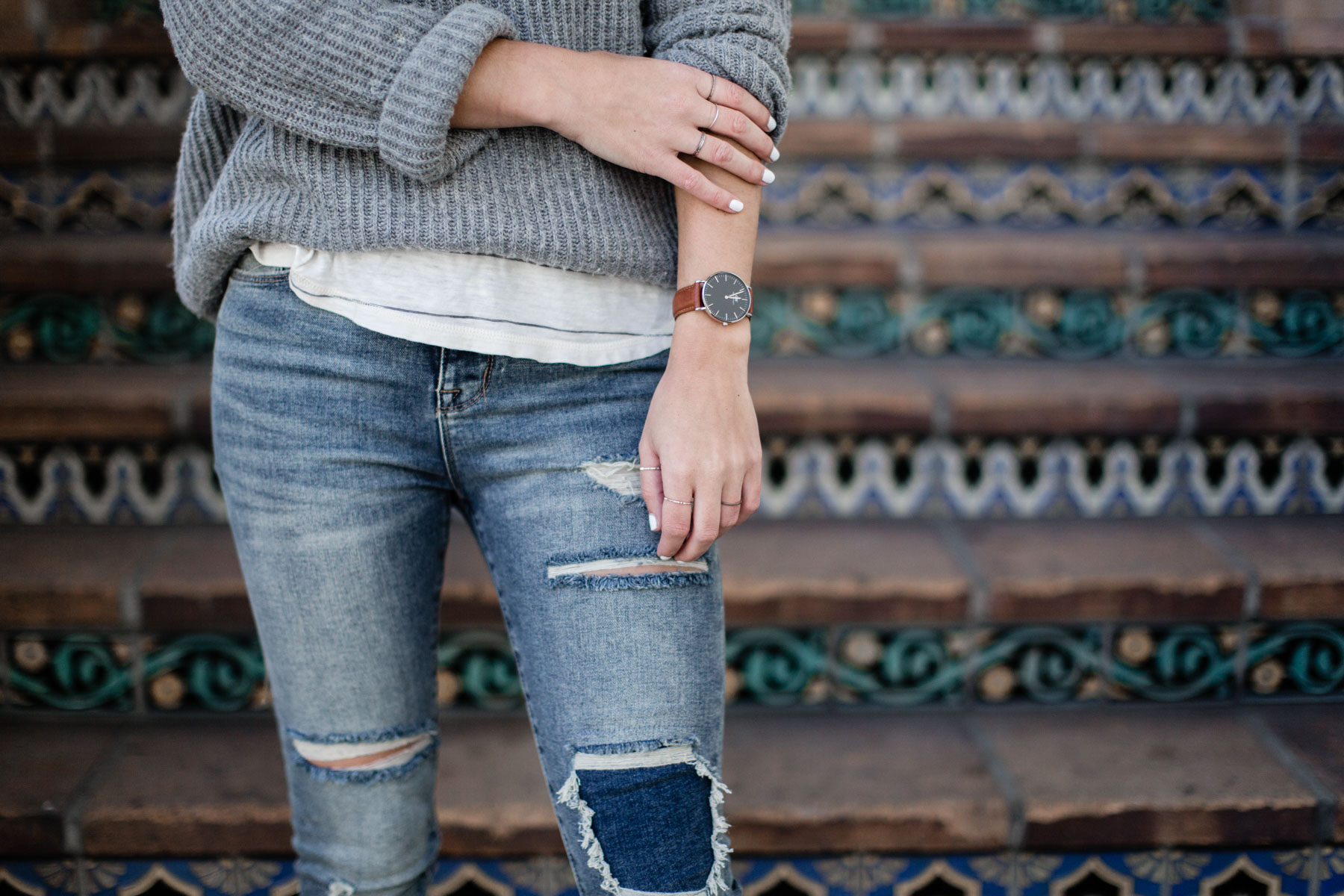 basic outfits with distressed denim, sweater, and striped tee