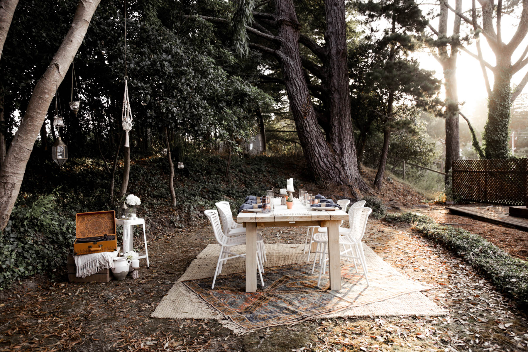 bohemian outdoor dining area with Article table and Urban Outfitters rug