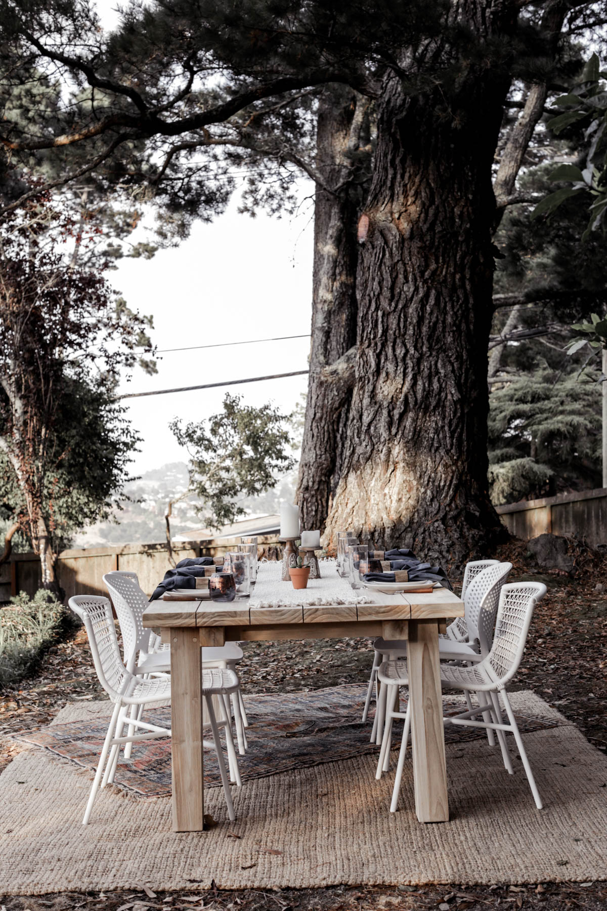 bohemian outdoor dining area with Article table and chairs