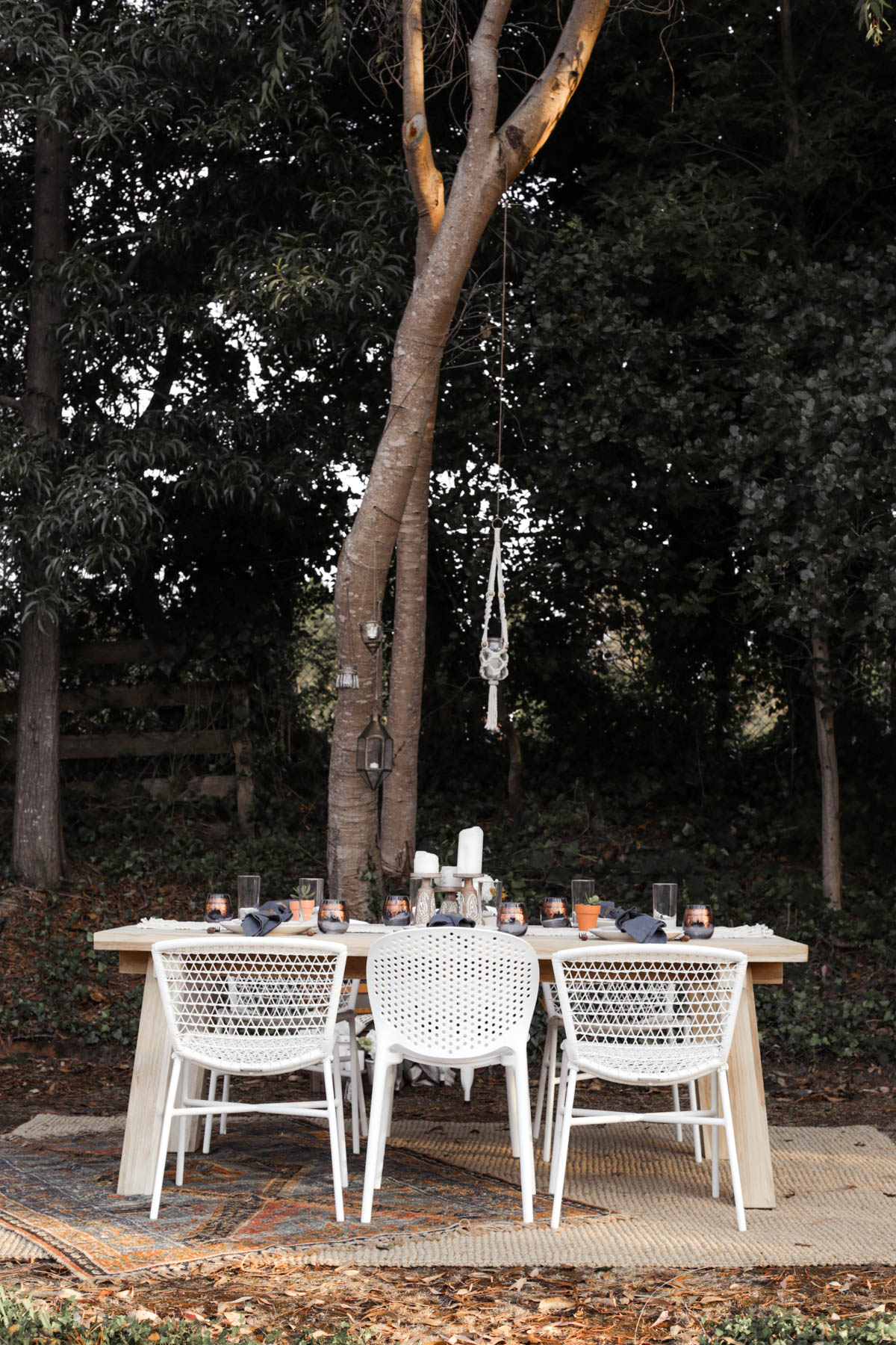 bohemian outdoor dining area with Article chairs