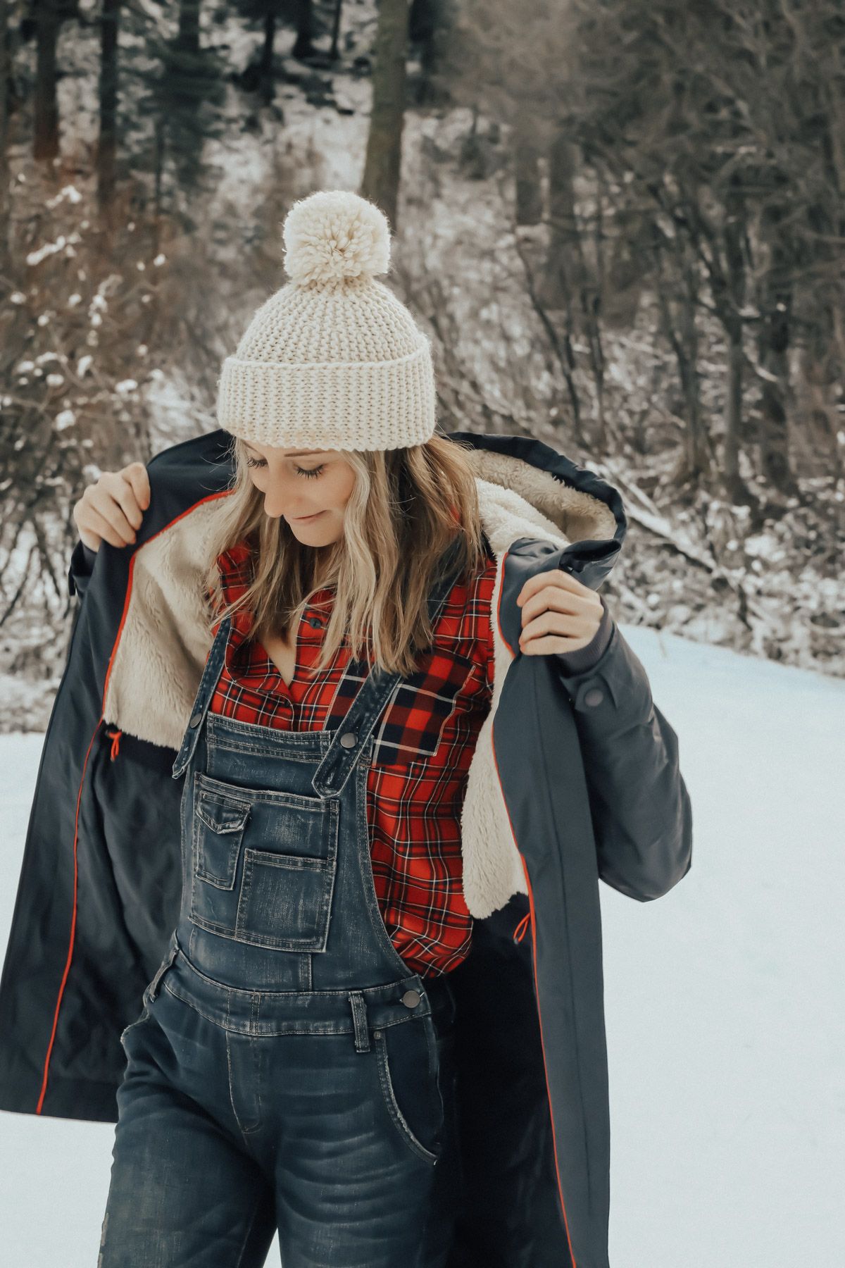 snow outfit with plaid shirt, overalls, and sorell boots