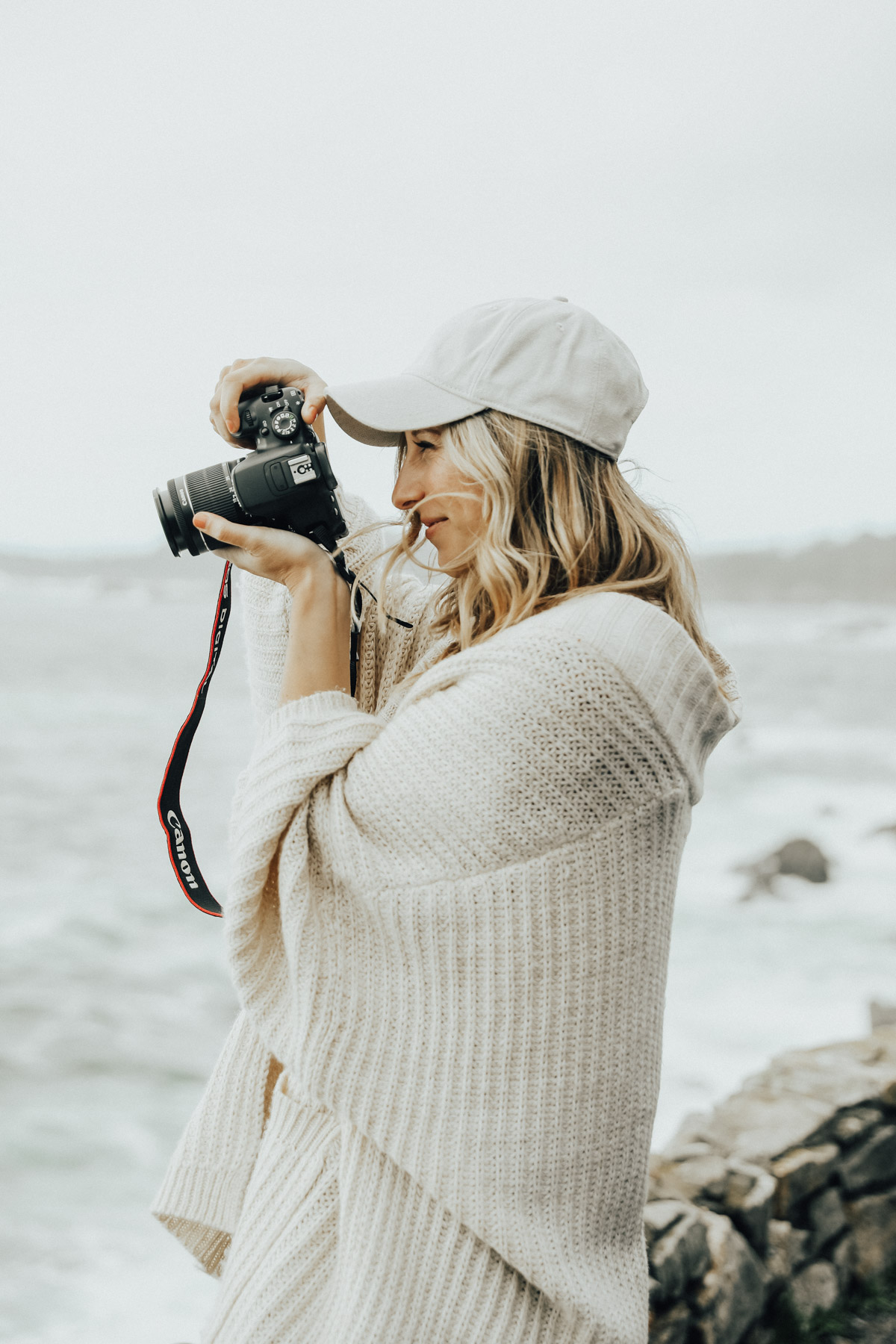 girl taking photos on west coast road trip with canon